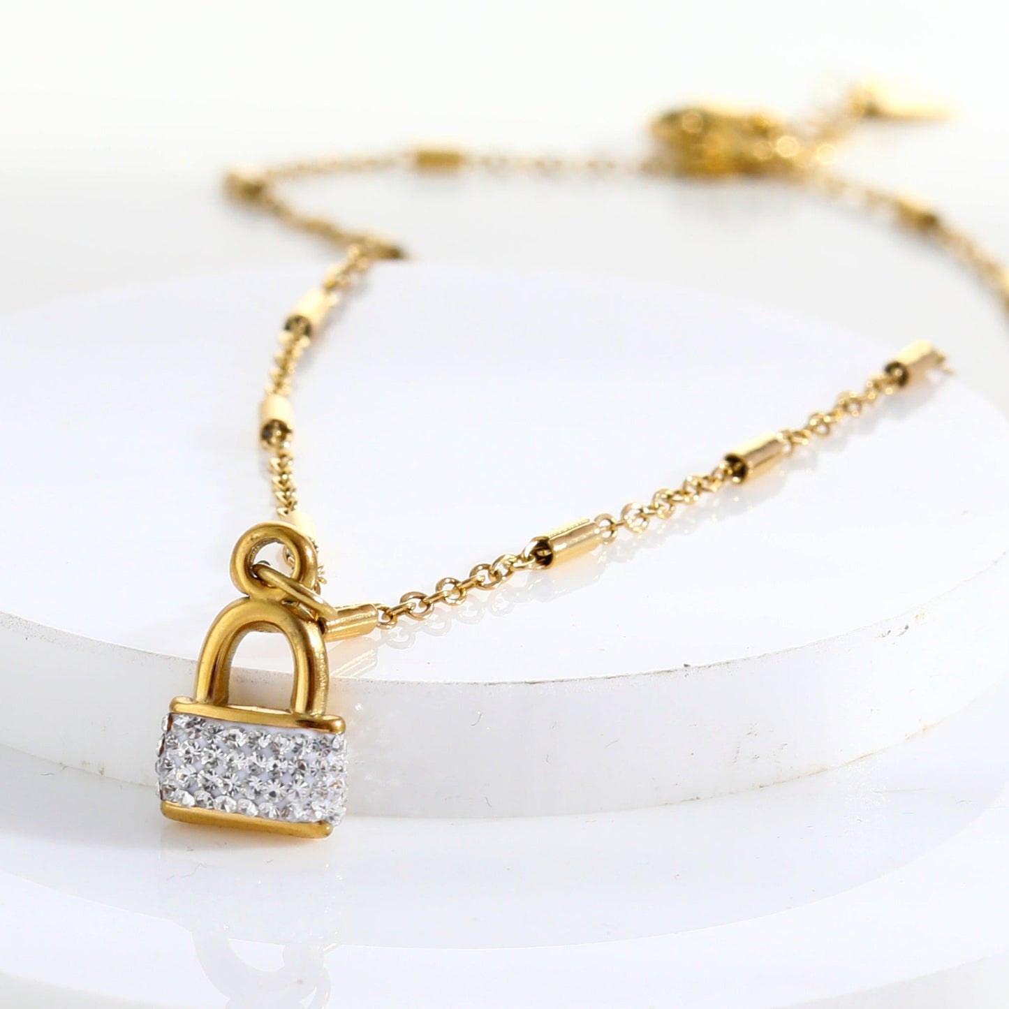 Style ABENI: Pavé Zirconia Pad Lock Pendant on a Tube Bead Chain Necklace in Gold