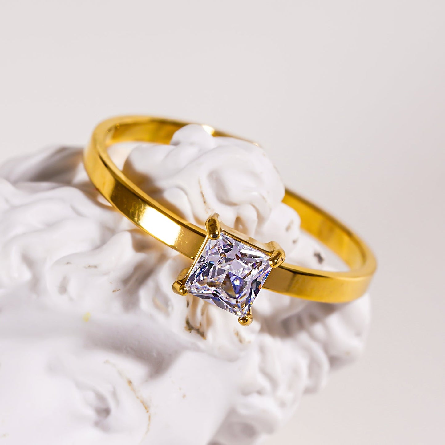 ADHIKA: Classic Gold Ring with a Square Zirconia Centerpiece