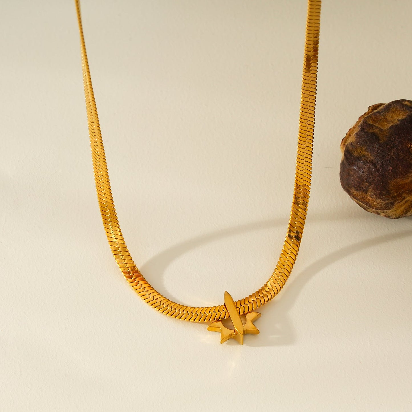 AGULHAS Gold: Celestial Elegance - Snake Skin Chain Necklace with Zirconia Embedded Star Charm