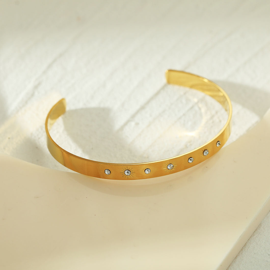CHIMAKAK: Star-Engraved Zirconia Embedded Band Bracelet in Gold