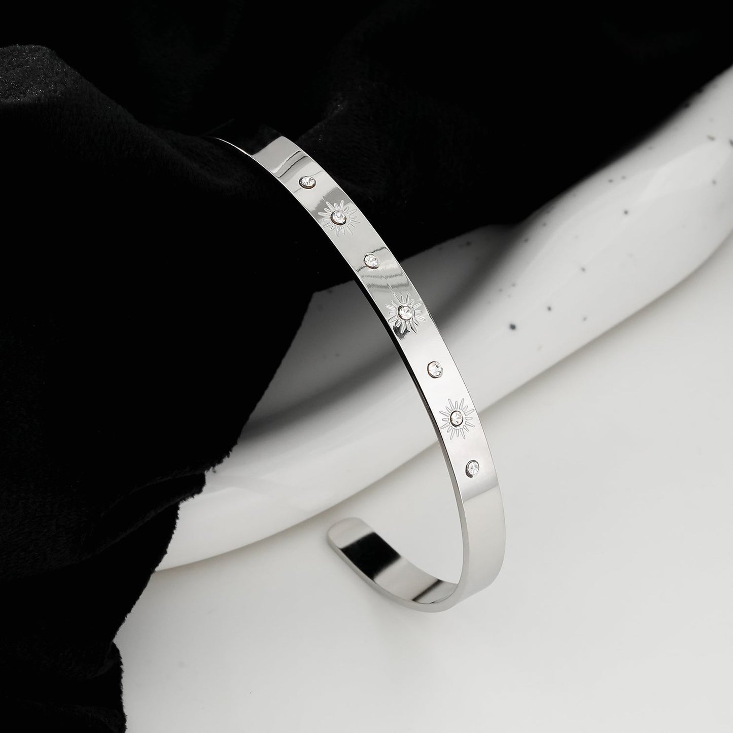 CHIMAKAK: Star-Engraved Zirconia Embedded Band Bracelet in Silver Toned White Gold