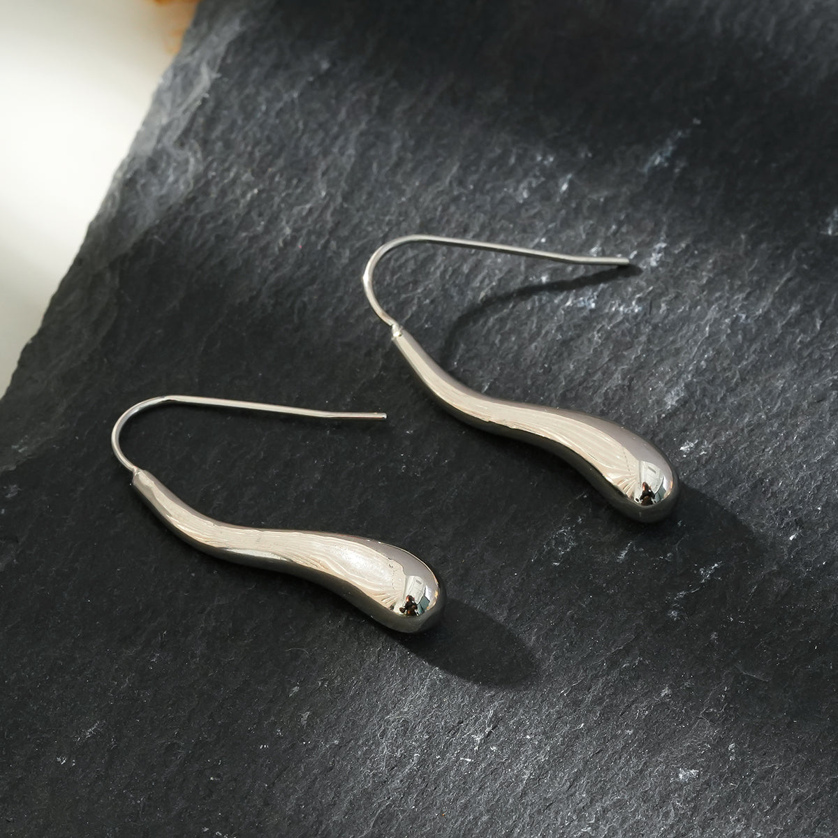 Style CORNING Silver (White Gold): Tadpole-Shaped Earrings – Unique Elegance with a Playful Twist