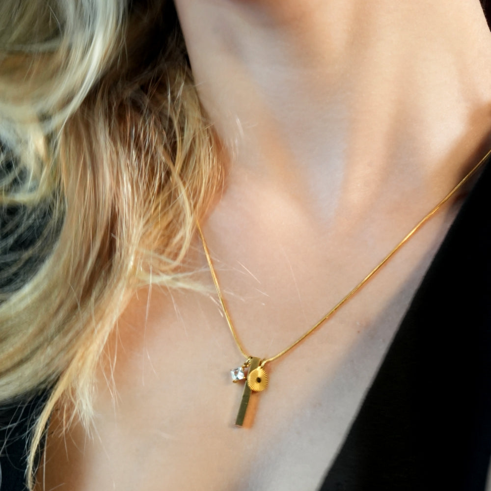 Style DEFNIE: Snake-Skin textured Dainty Chain Necklace Anchoring a Trio of Charms