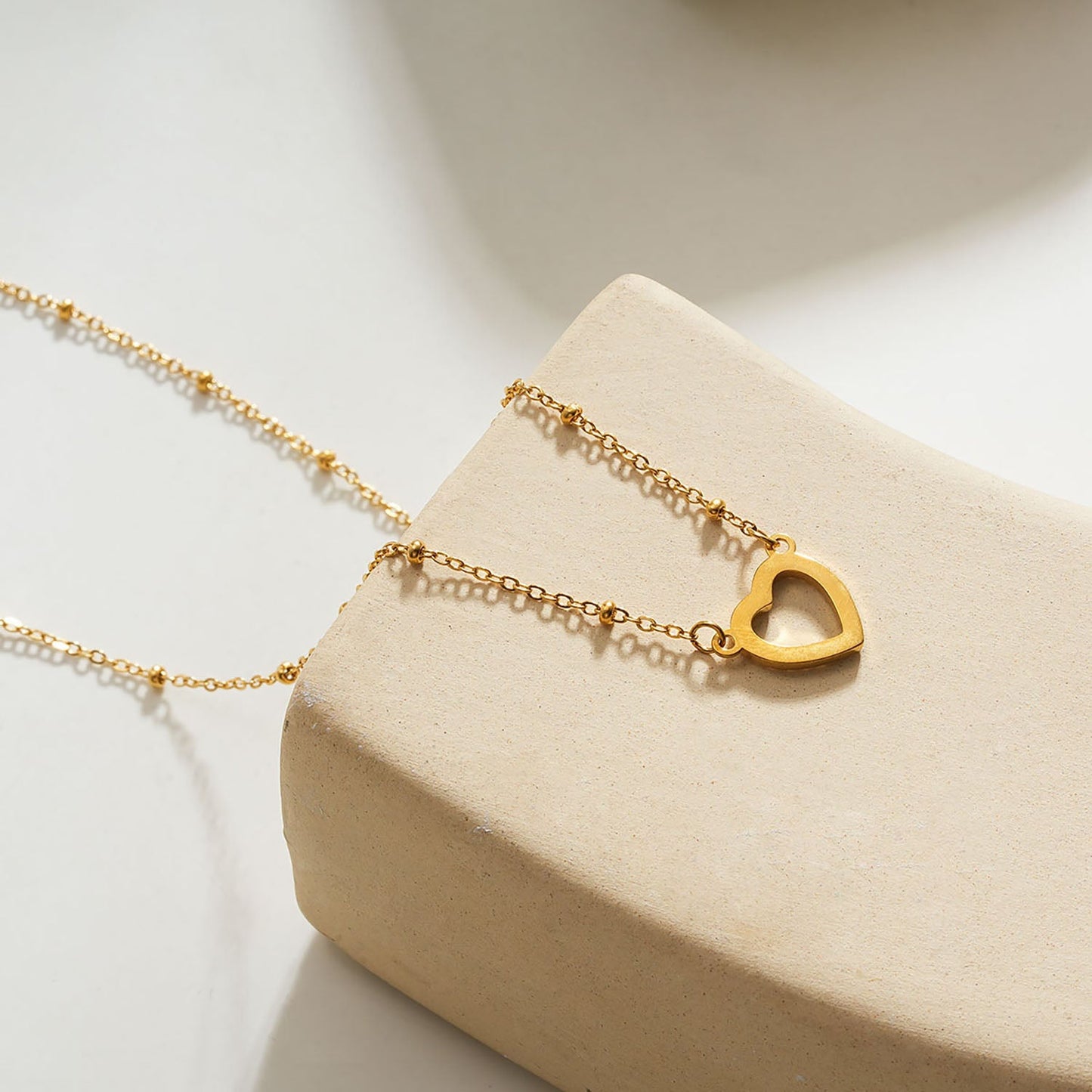 Style CHERISH Gold: Beaded Chain Anchoring an Elegant Pavé Heart Charm Pendant