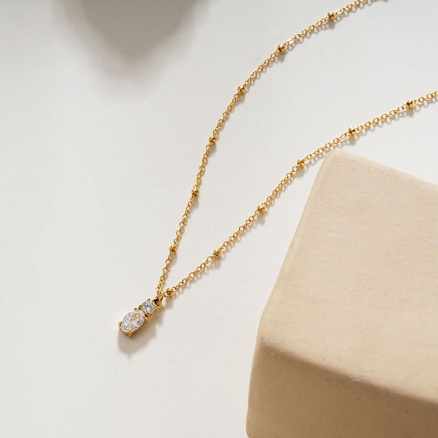 CABBANA Gold:  A Duo Set of Zirconia Charm Pendants on a Beaded Chain Necklace