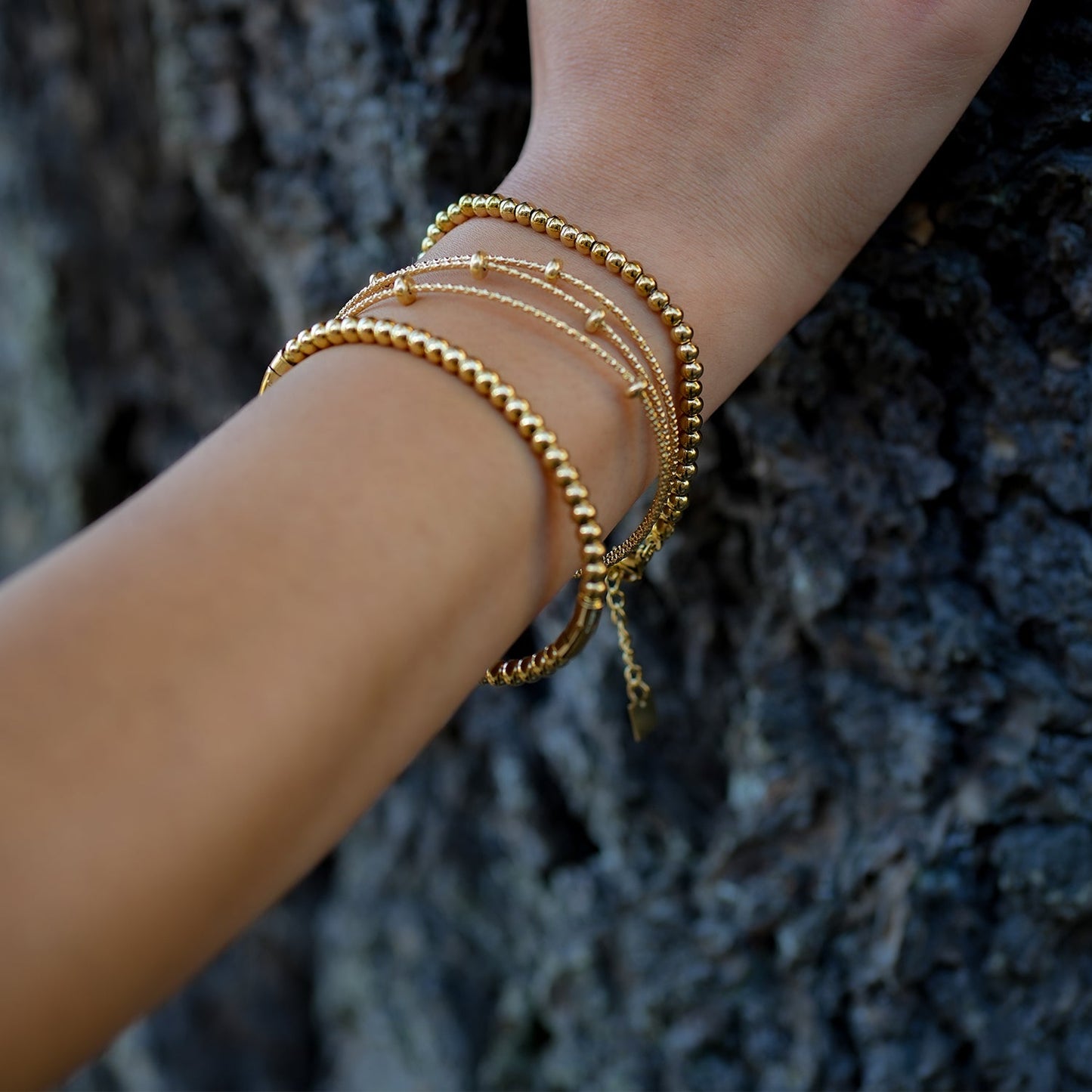 Style FARZIKA Gold: Triple Stacked Textured Beaded Bracelet