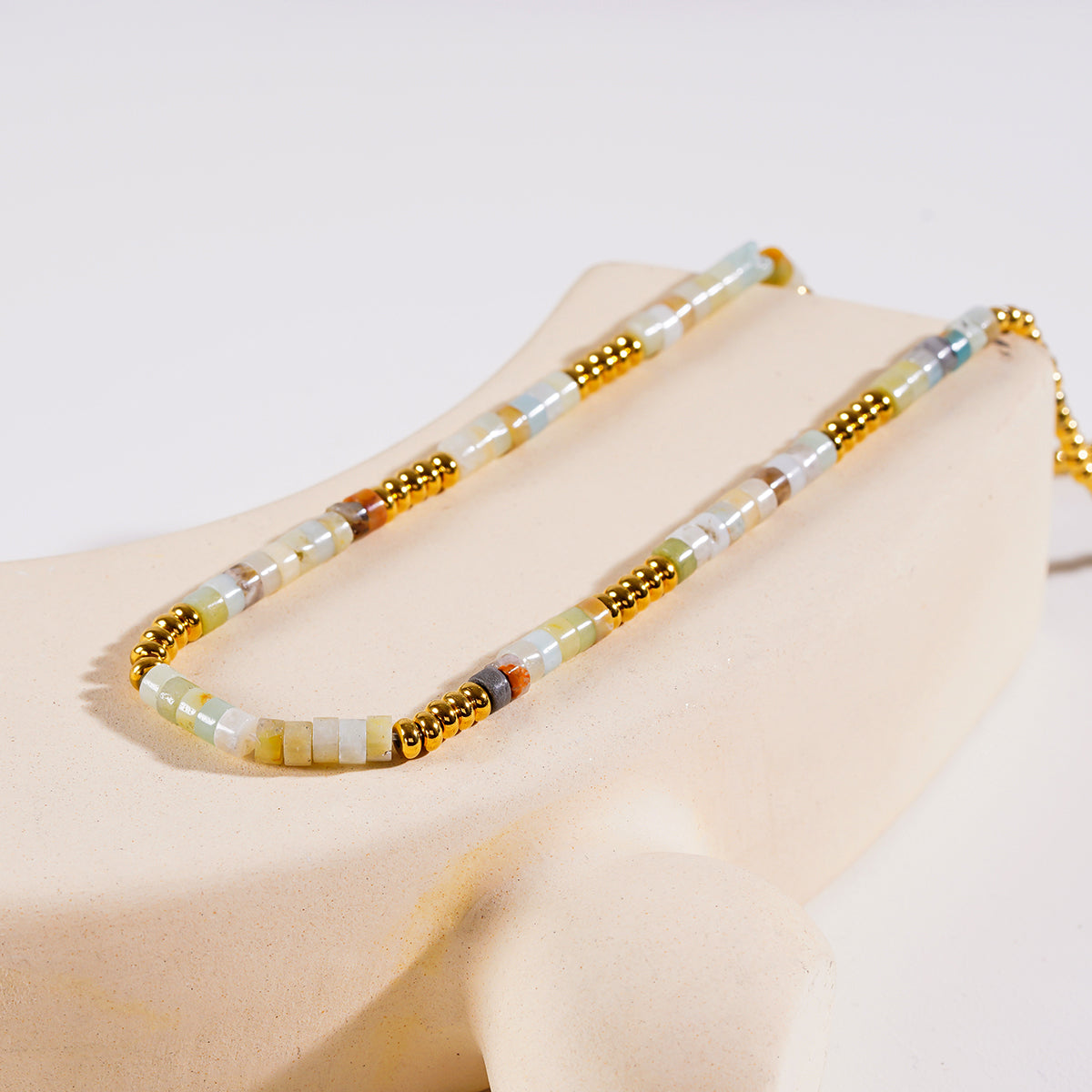 ISHANI: Pink Aventurine Stones and Gold Beaded Necklace