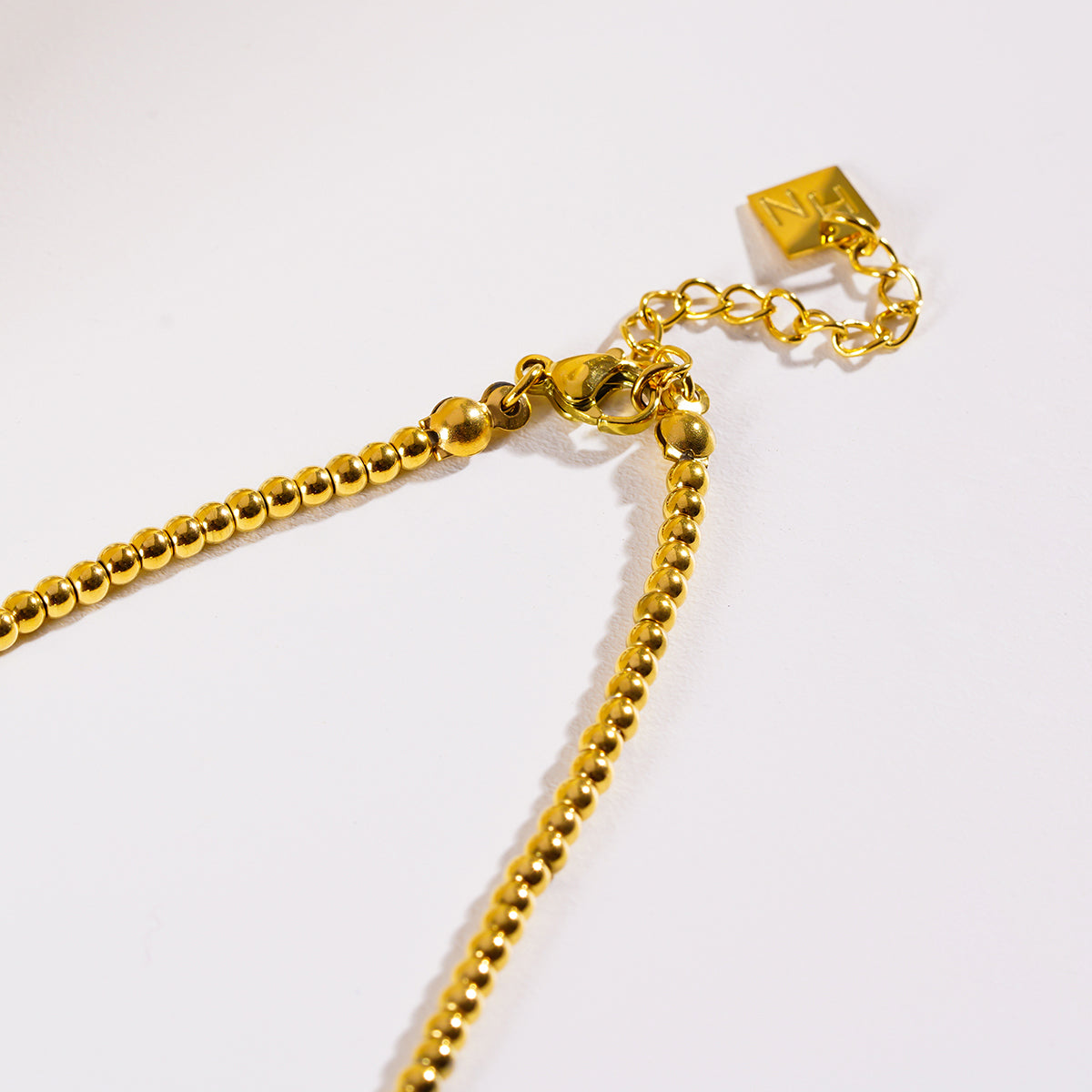 ISHANI: Pink Aventurine Stones and Gold Beaded Necklace