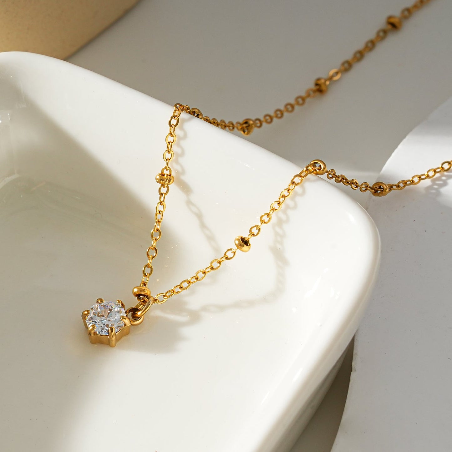 KADIRI Gold:  Solitaire Zirconia Charm Pendant on a Beaded Chain Necklace