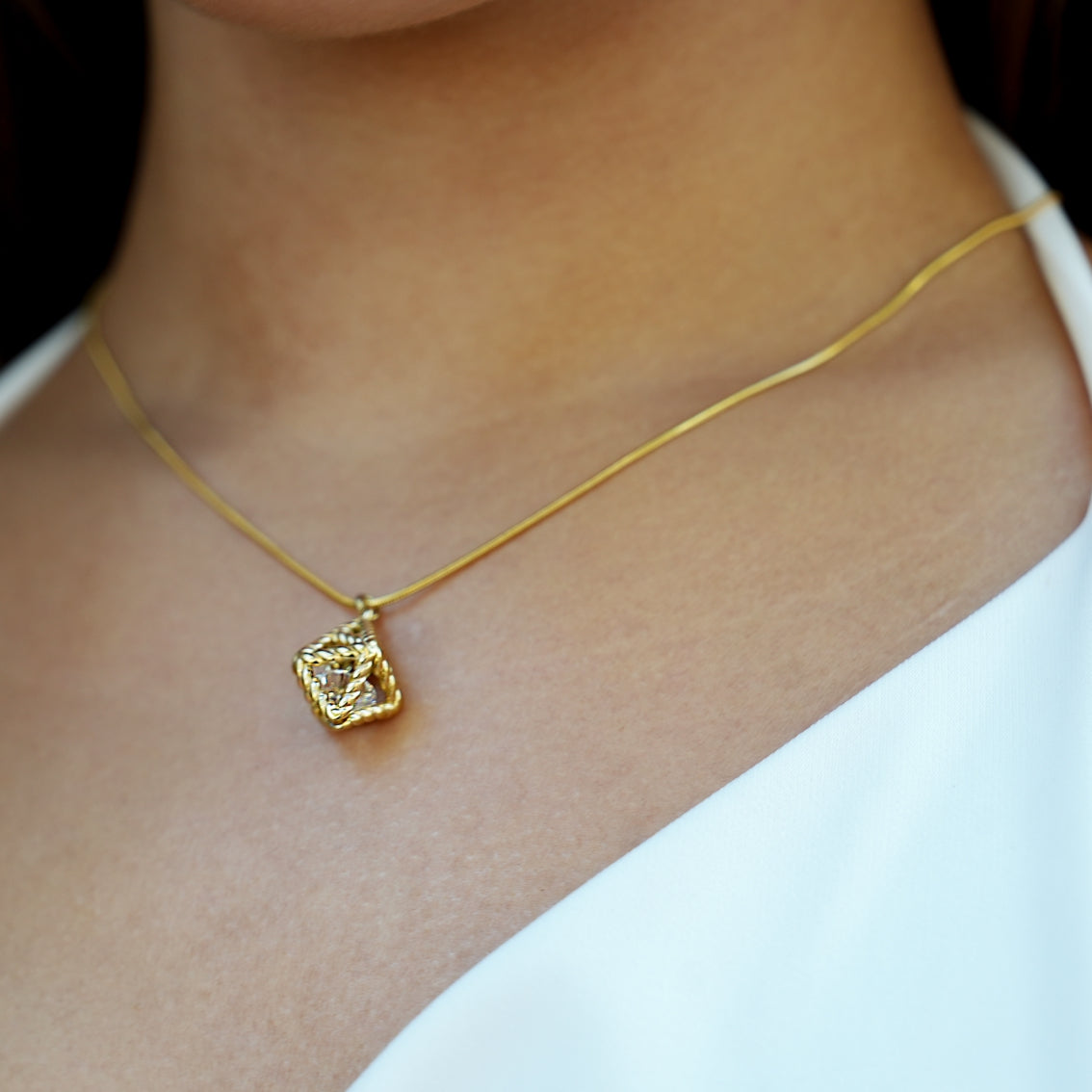 Style KARJAT: Gold Chain Necklace with Geometric Caged Zirconia Pendant