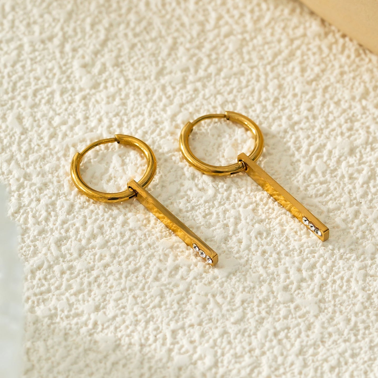 Style MAYLA: Gold Hoops with a Minimalist Charm featuring a Trio of Zirconia Gemstones