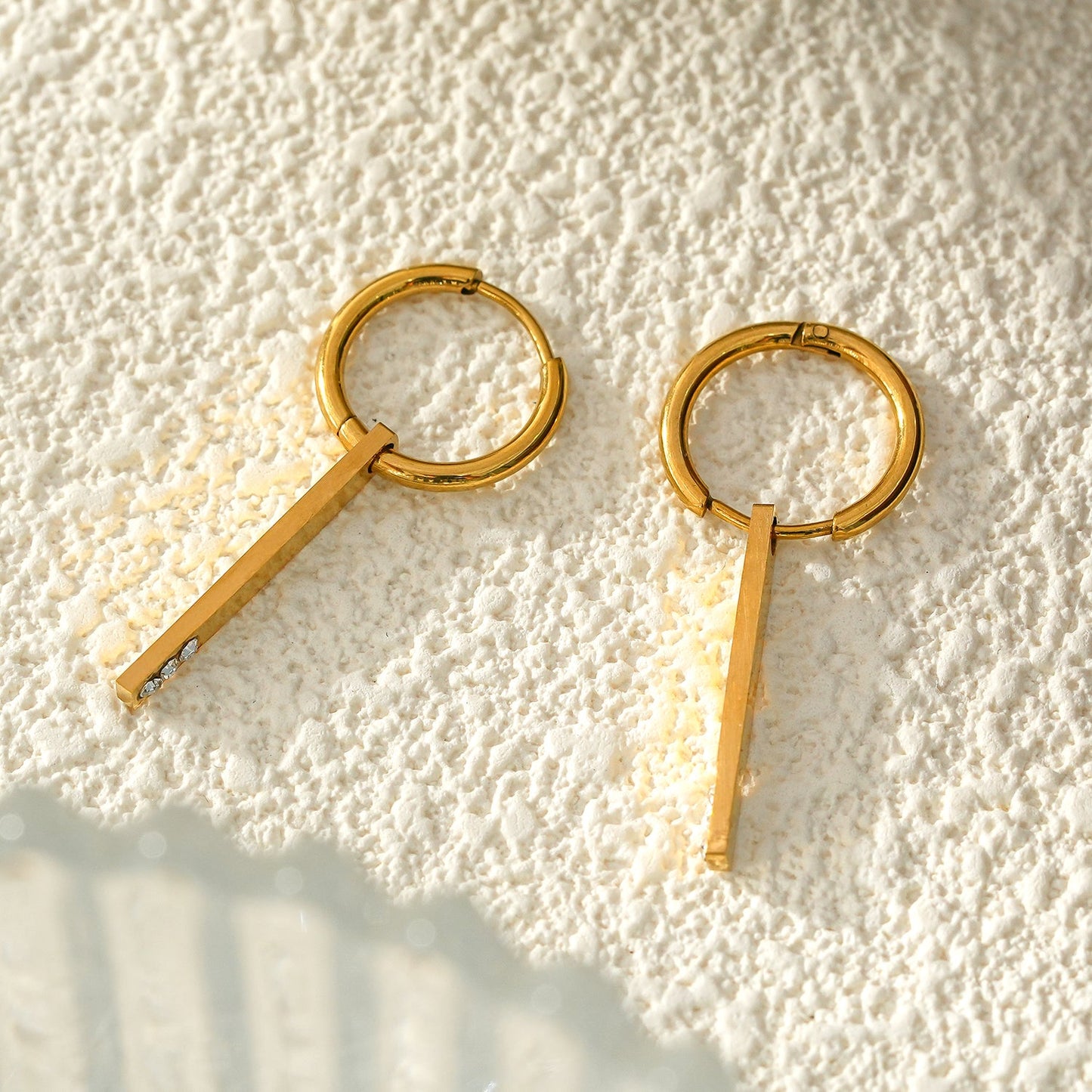 Style MAYLA: Gold Hoops with a Minimalist Charm featuring a Trio of Zirconia Gemstones