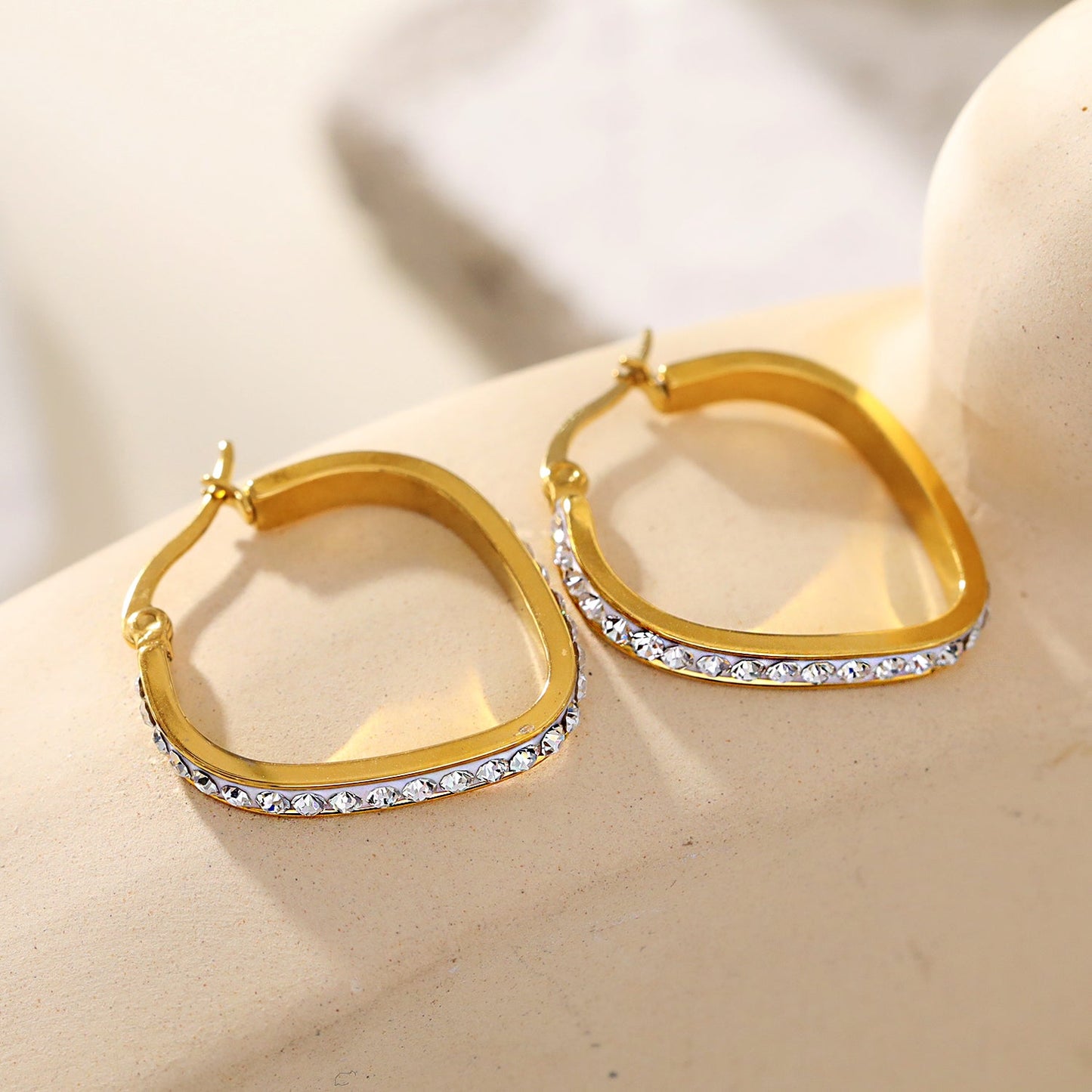 Style MELFI Gold: Abstract Heart Shaped Hoops embedded with Zirconia Gemstones