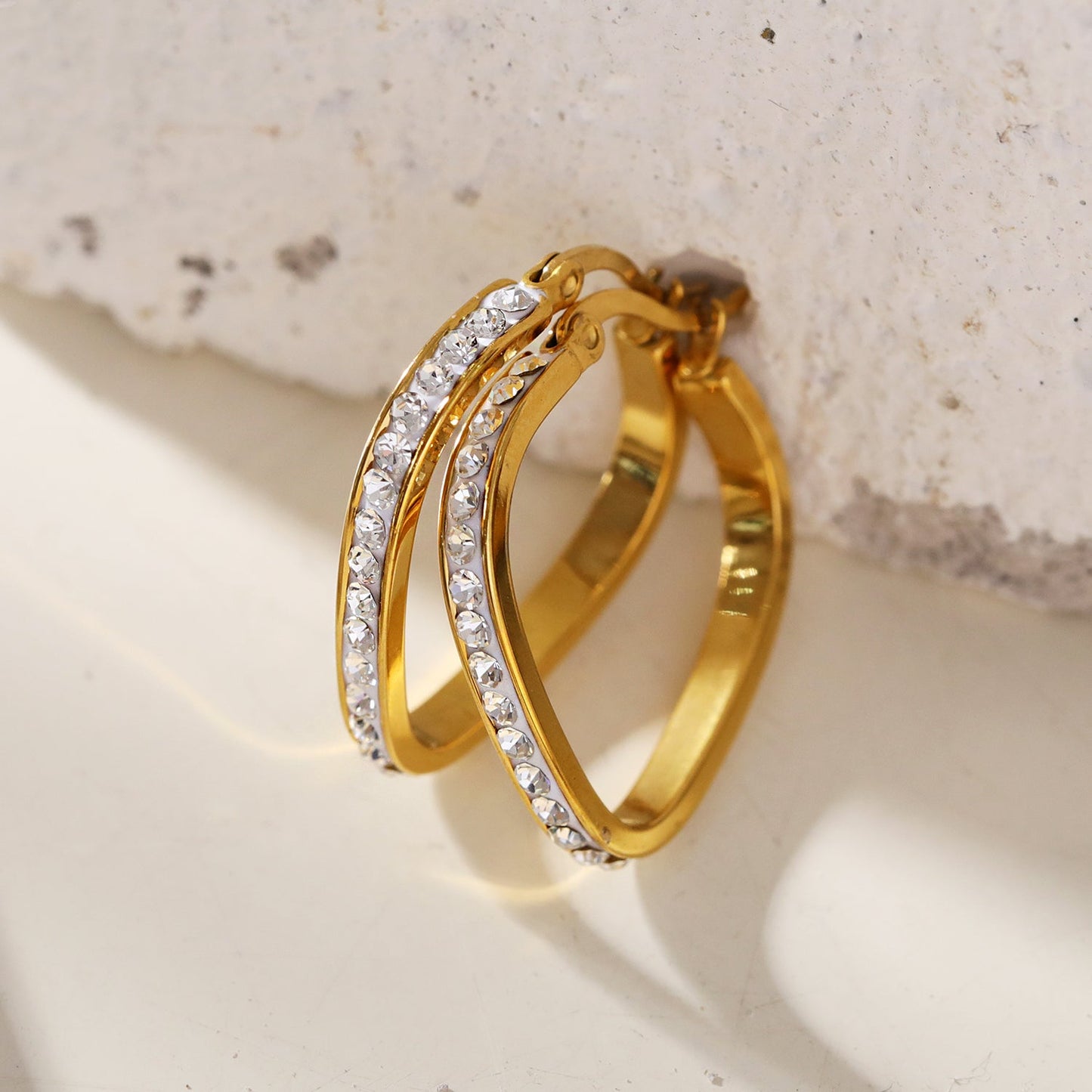 Style MELFI Gold: Abstract Heart Shaped Hoops embedded with Zirconia Gemstones