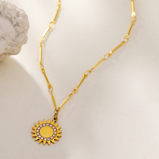 NOMIA Gold: Radiant Sunburst Pendant Zirconia Chain Necklace