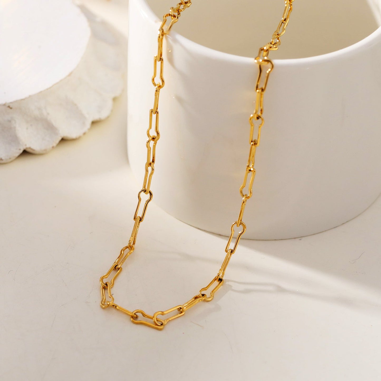 TIASA: Asymmetrical Paper Clip Gold Chain Necklace