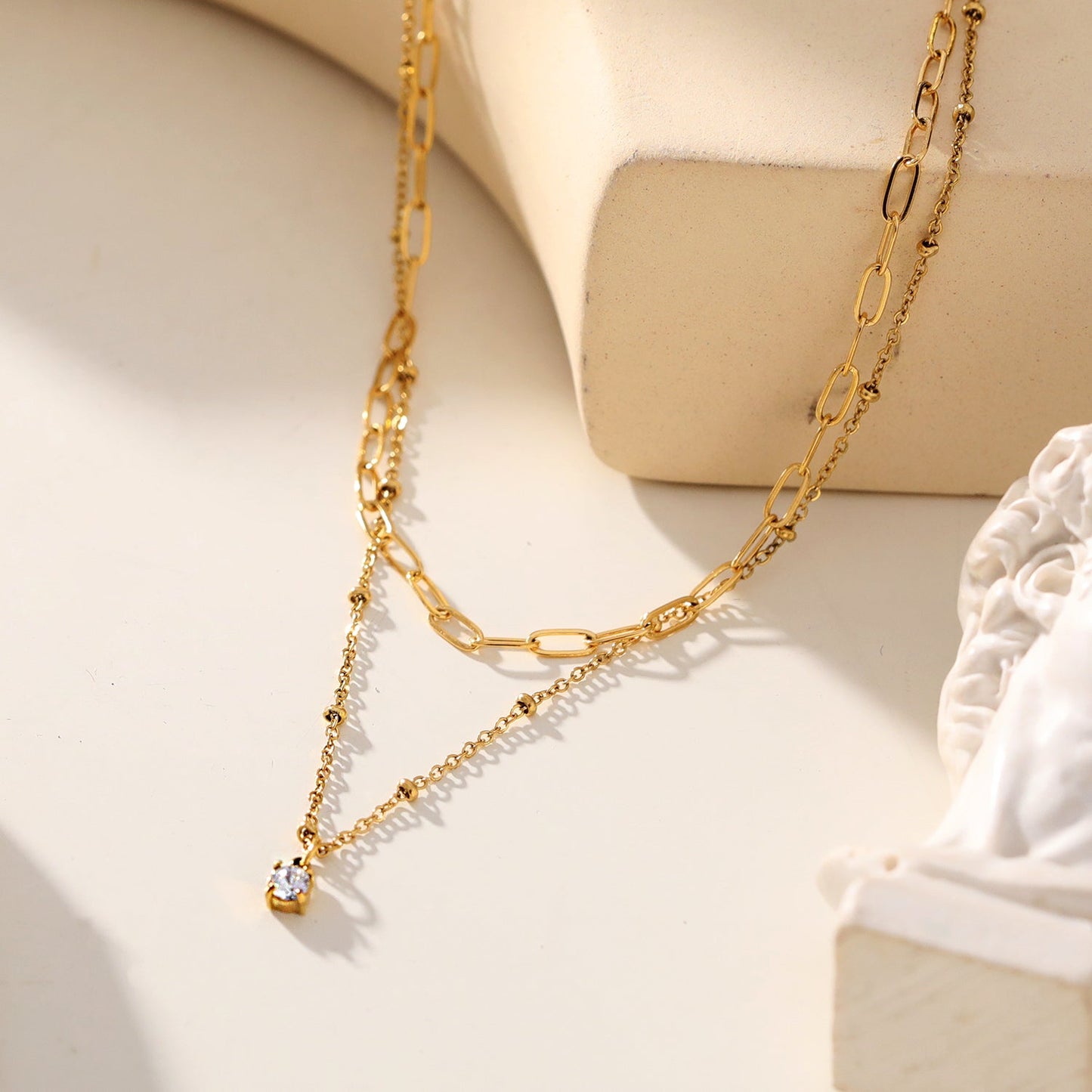 KATERI Gold: Pre-Layered Chains Necklace with a Solitaire Zirconia Charm Pendant