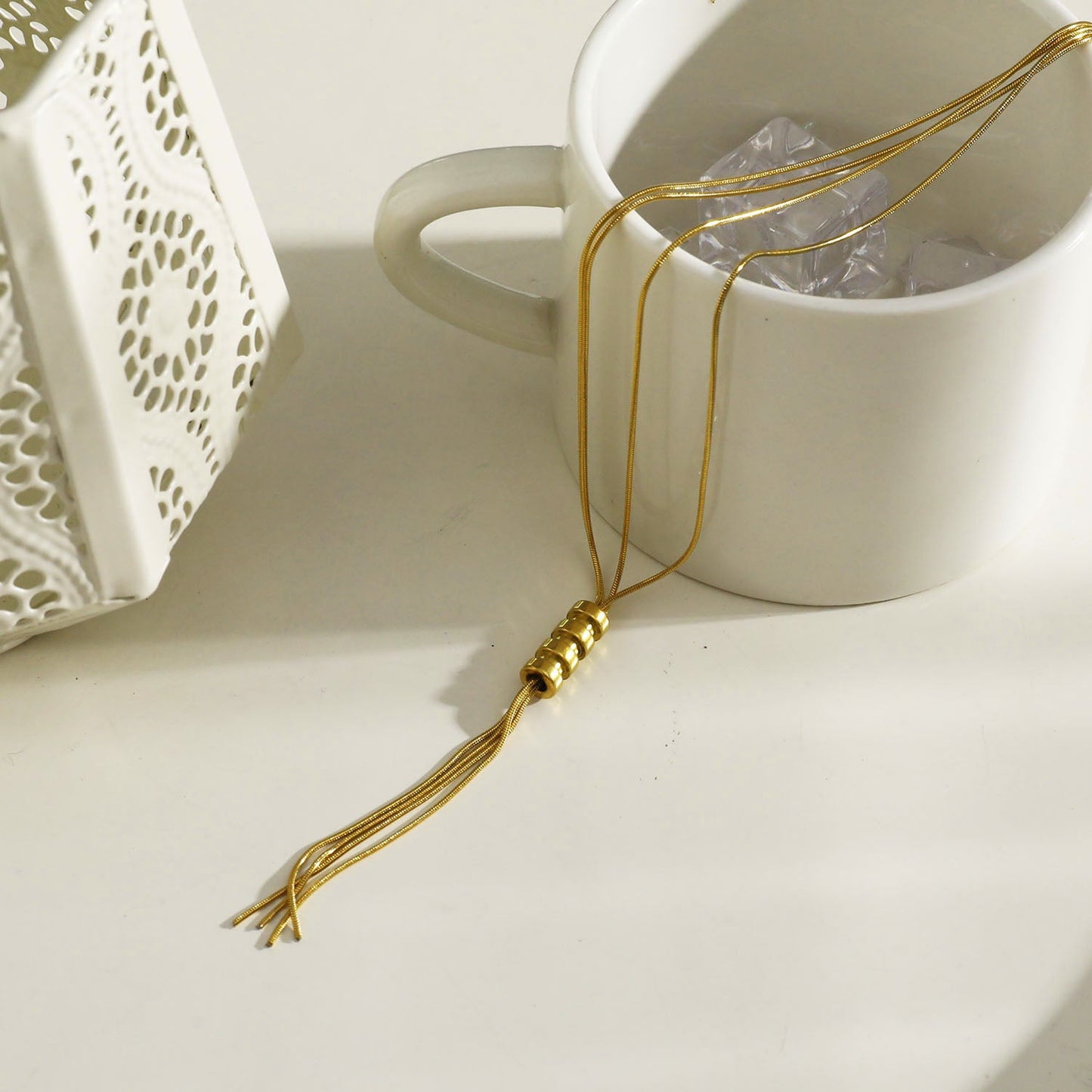 TELMA: Lariat Style Multi Stranded Necklace.