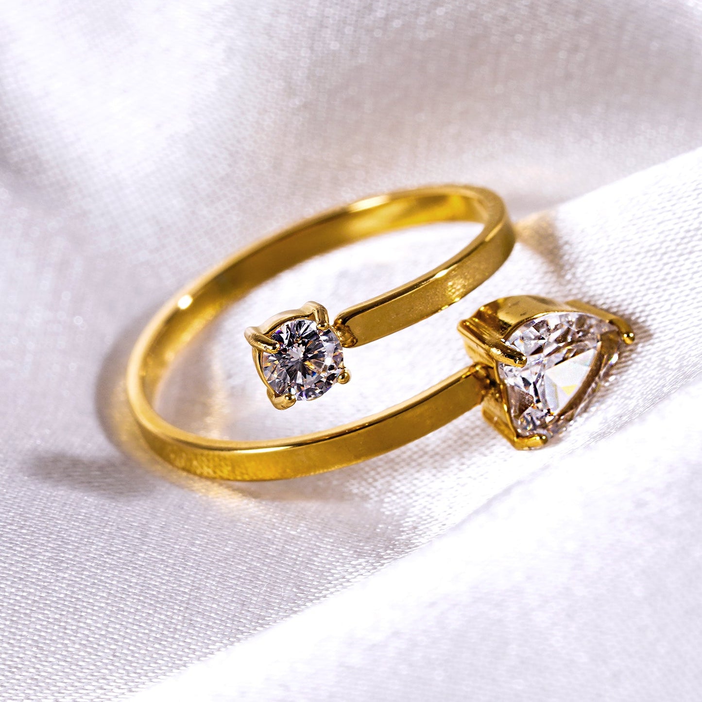 RIZALINA: Classic Band Ring Anchoring Heart Shaped & Rounded Zirconia Gemstones