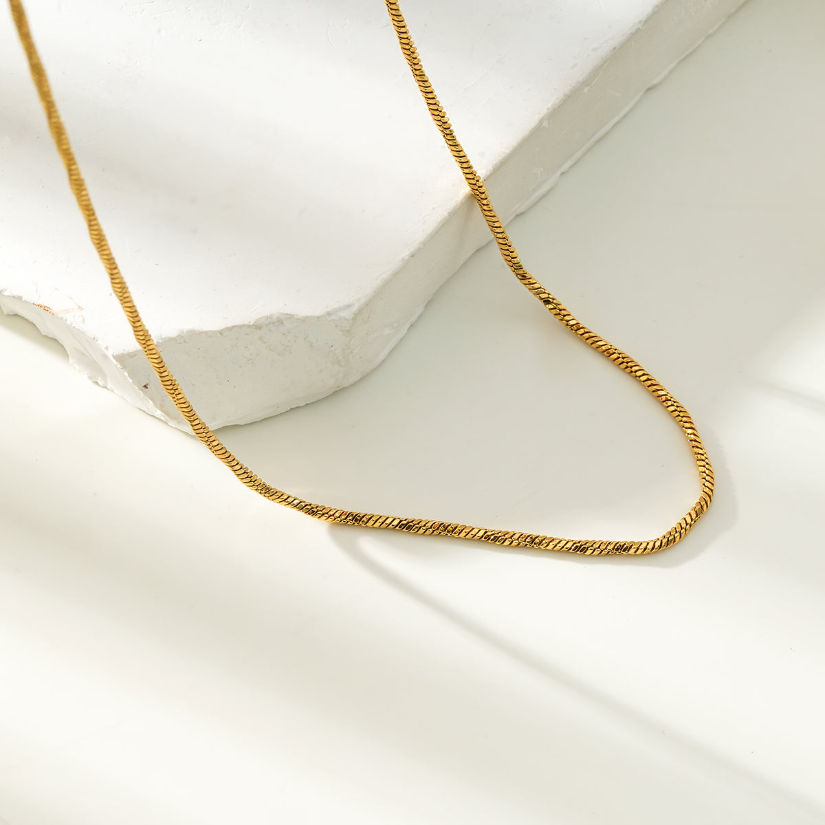 SKAGWAY: Minimalist Twisted Textures Chain Necklace in Gold
