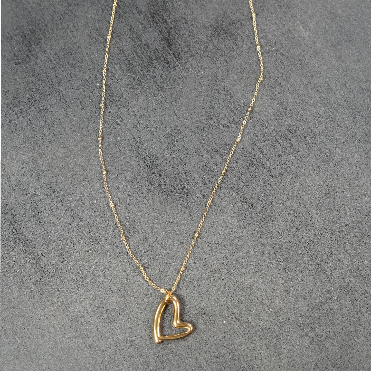 SMITTEN Gold: Dainty Beaded Chain Anchoring an Abstract Heart Shaped Pendant