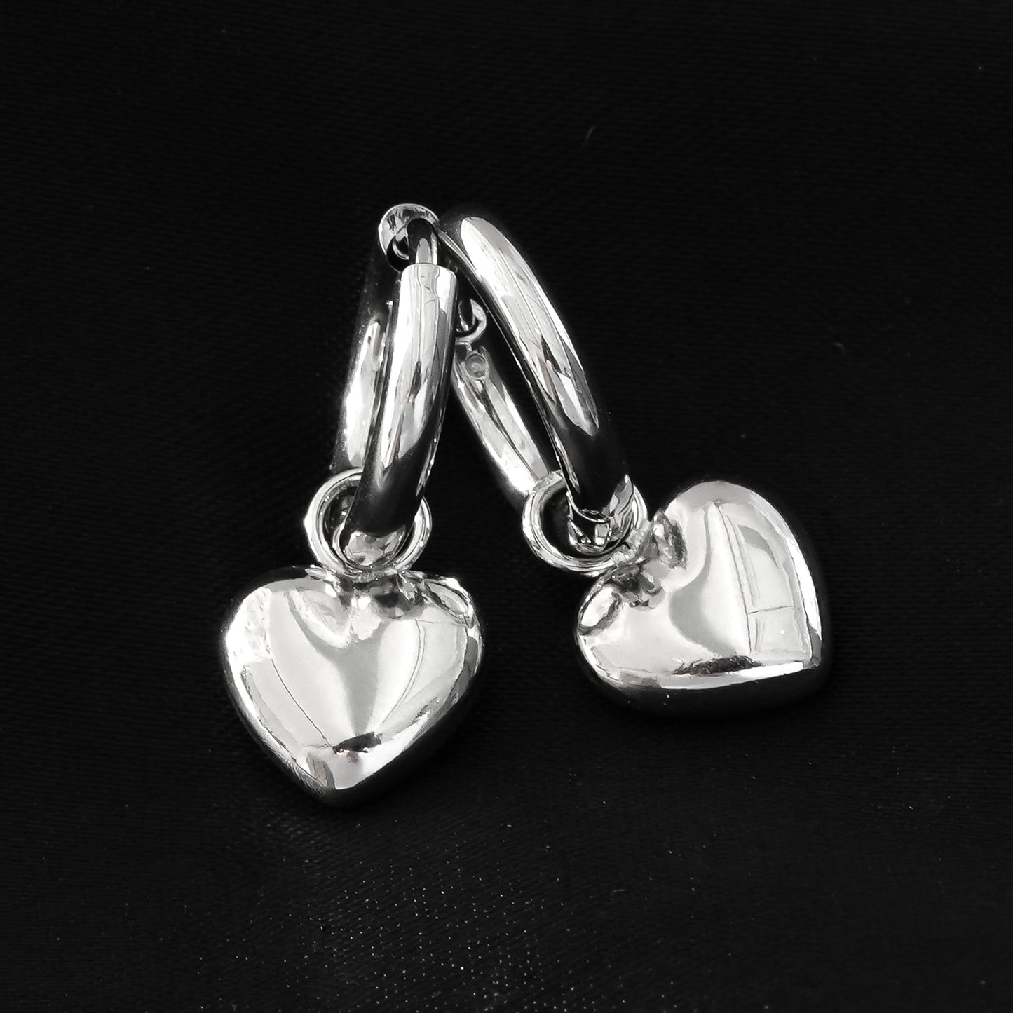STOWE Silver: Mini Hoop Earrings Anchoring a Heart Shaped Charm