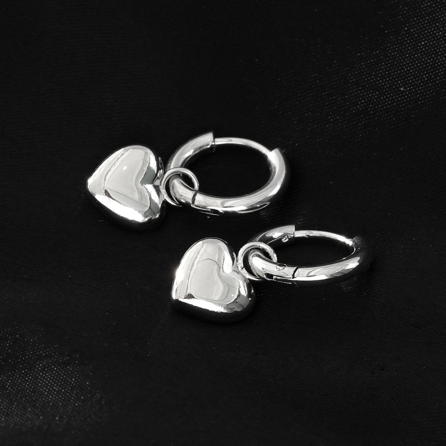 STOWE Silver: Mini Hoop Earrings Anchoring a Heart Shaped Charm
