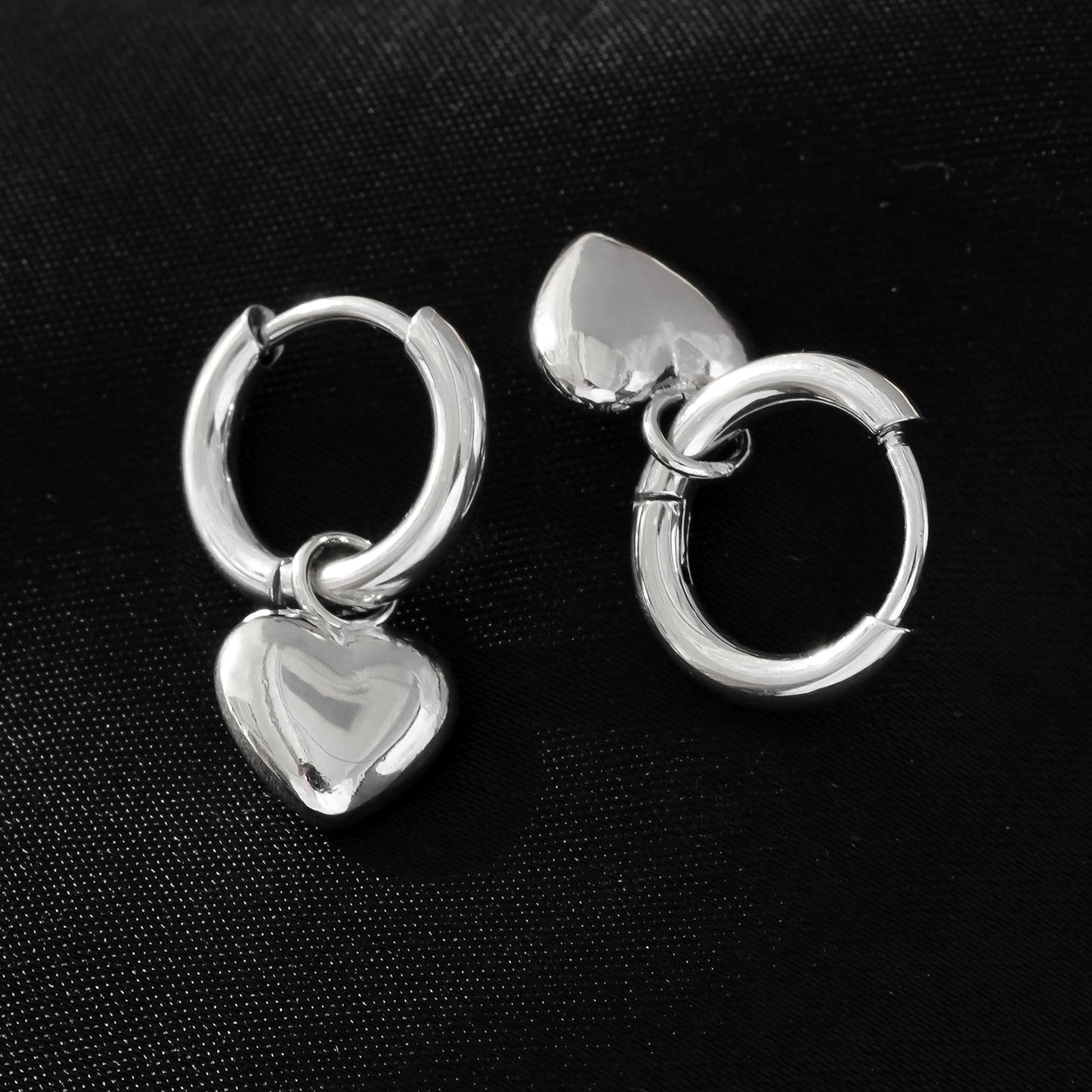STOWE Silver: Mini Hoop Earrings Anchoring a Heart Shaped Charm